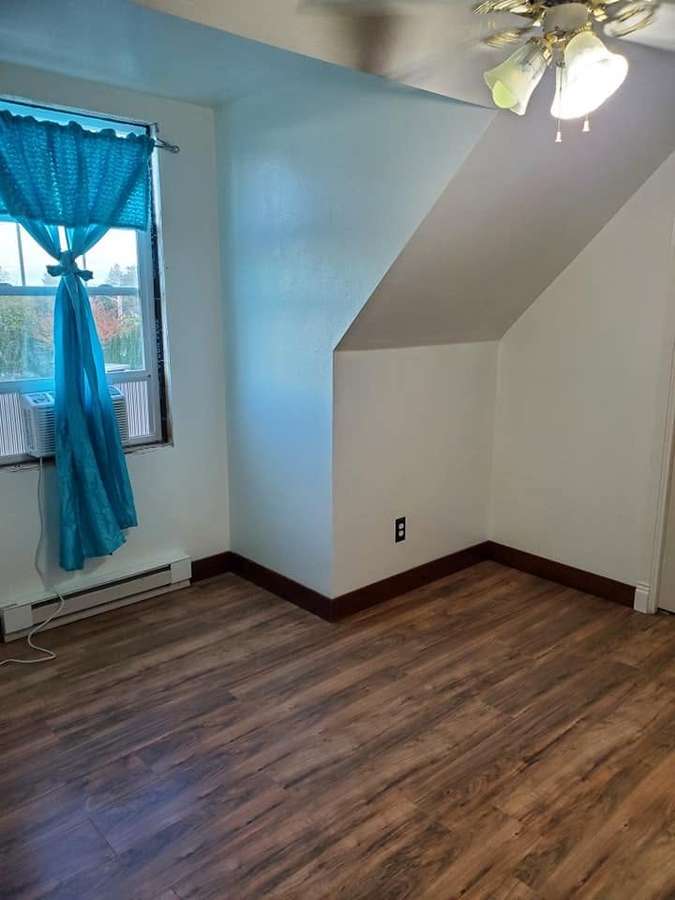 Bedroom with new wood-look flooring